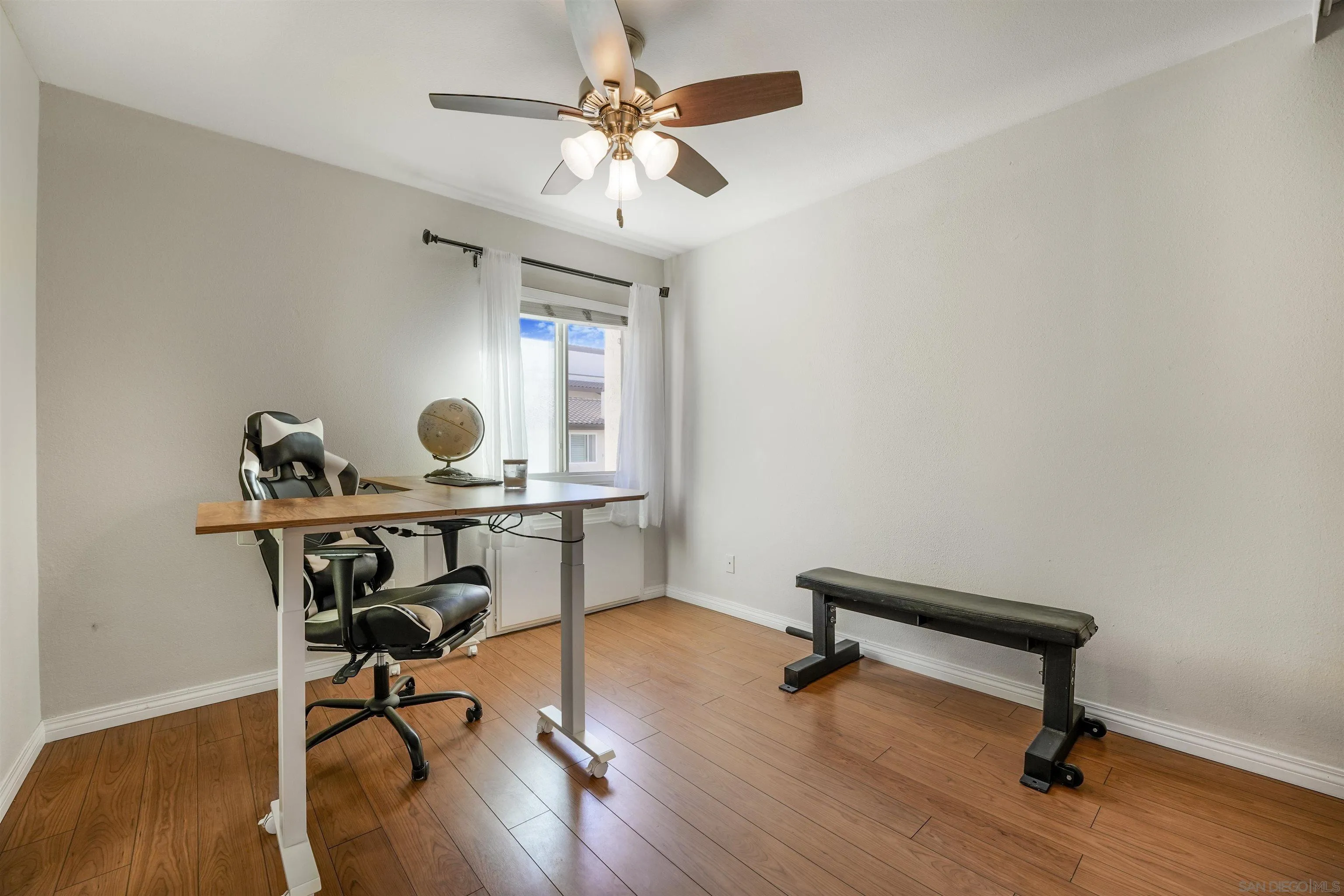 6747 Friars Road, Unit 113 San Diego, CA 92108 - Photo 16 of 48 a view of a workspace with furniture and a window