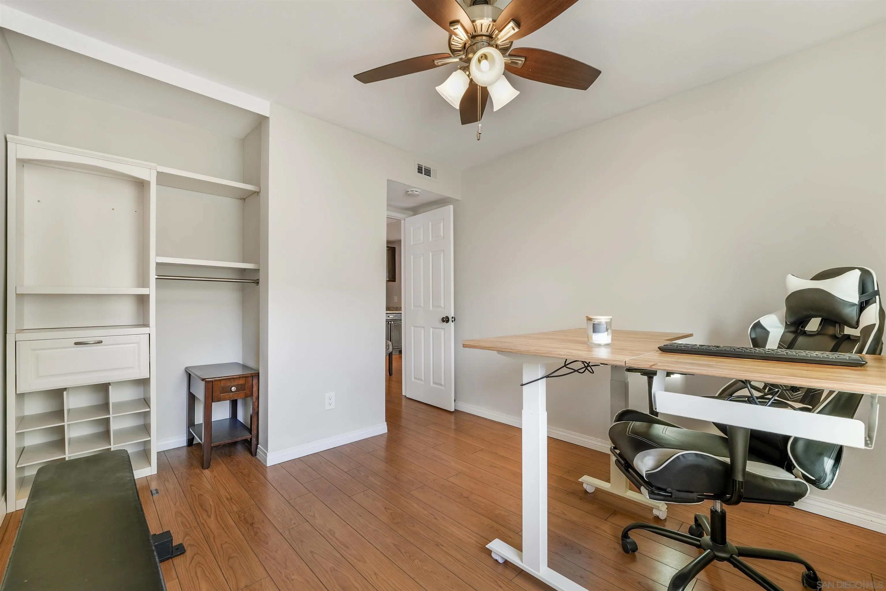 6747 Friars Road, Unit 113 San Diego, CA 92108 - Photo 17 of 48 a view of a workspace with furniture and wooden floor