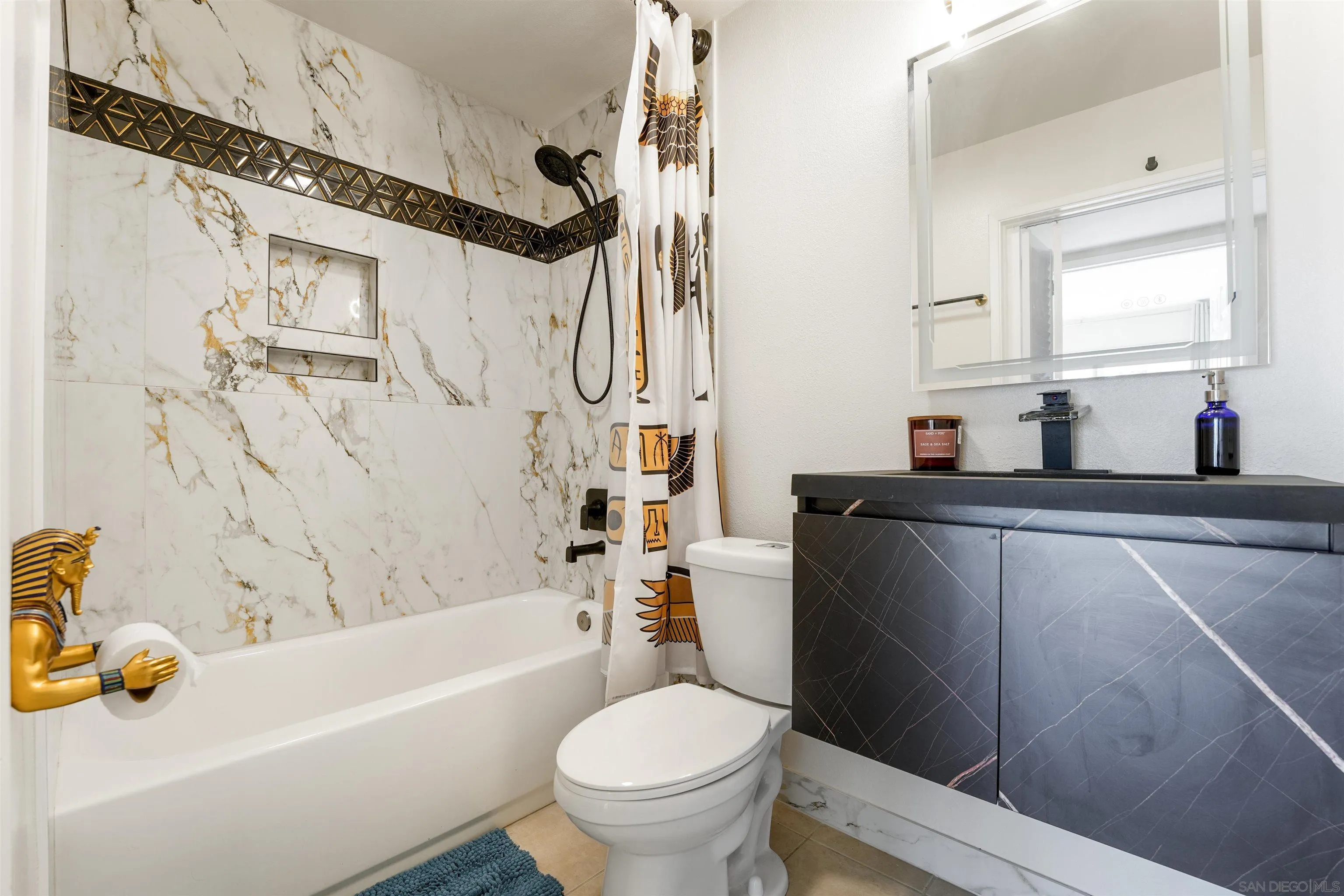 6747 Friars Road, Unit 113 San Diego, CA 92108 - Photo 31 of 48 a bathroom with a sink a toilet and a bathtub