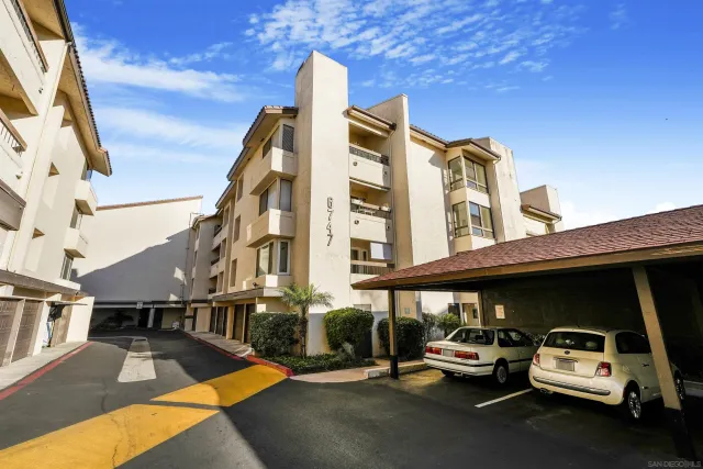 a view of a car park in front of building