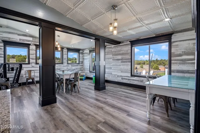 a bathroom with a white bath tub a shower and a sink