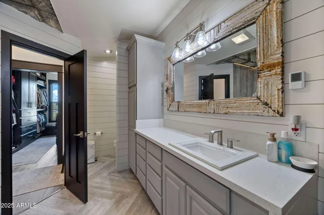 a bathroom with a sink and a mirror