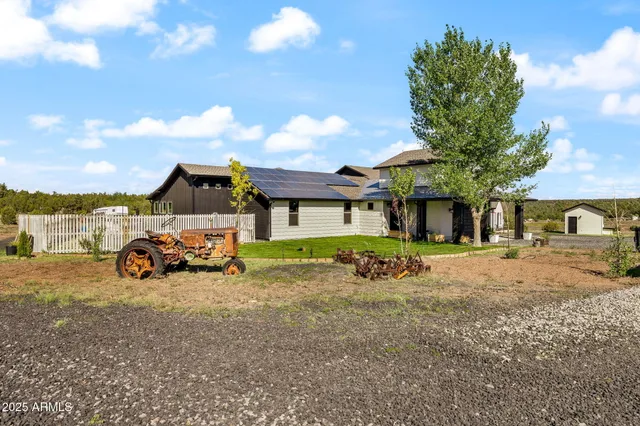 a view of a car is parked in front of a house