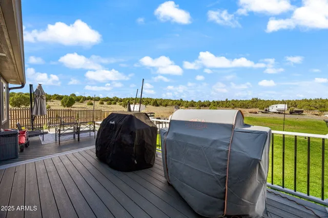 a kitchen with a refrigerator stove and white cabinets