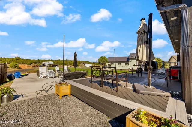 a bedroom with a bed a desk and chair