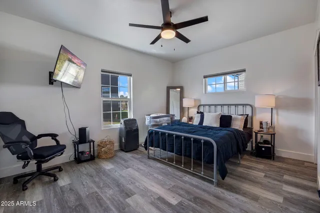 a bedroom with a large bed and a window