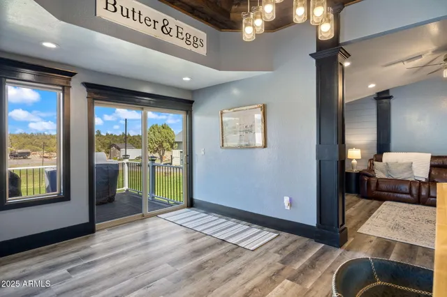 a room with stainless steel appliances kitchen island granite countertop a refrigerator and a stove top oven