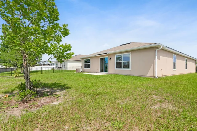 a view of a garden with a building in the background