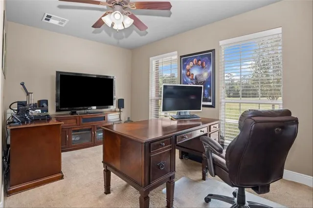 a view of a workspace with furniture