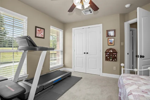 a bedroom with furniture and window