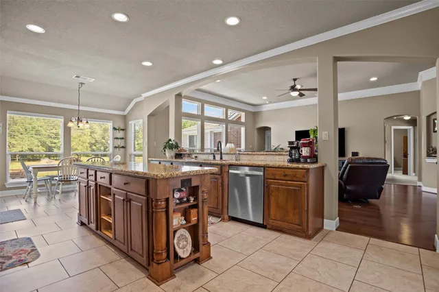 a kitchen with stainless steel appliances granite countertop a stove and a sink