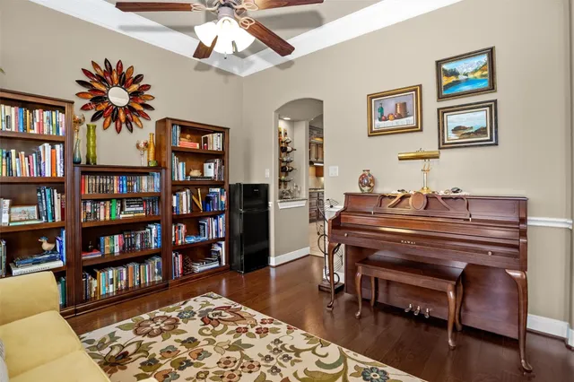 a reading room with furniture and a book shelf