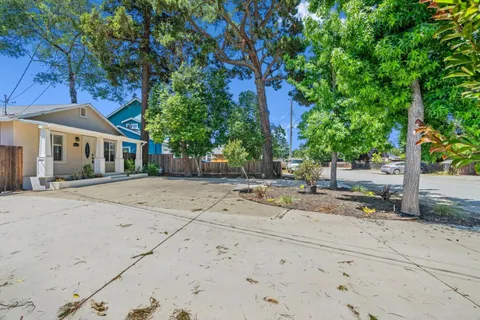 front view of a house with a tree