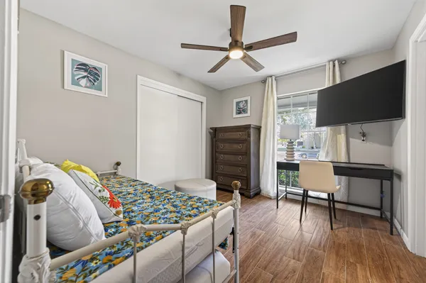 a bedroom that has a bed and a chair in it