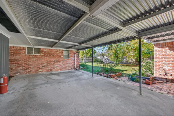 a view of a backyard of the house