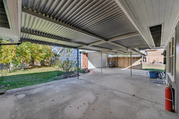 a view of a backyard of the house