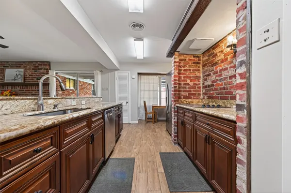 a kitchen with stainless steel appliances granite countertop lots of counter top space