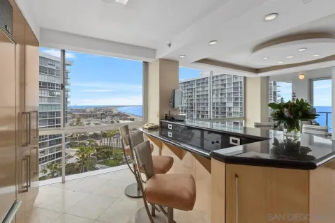 a kitchen with a sink and a large window