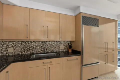 a bathroom with a shower and a sink