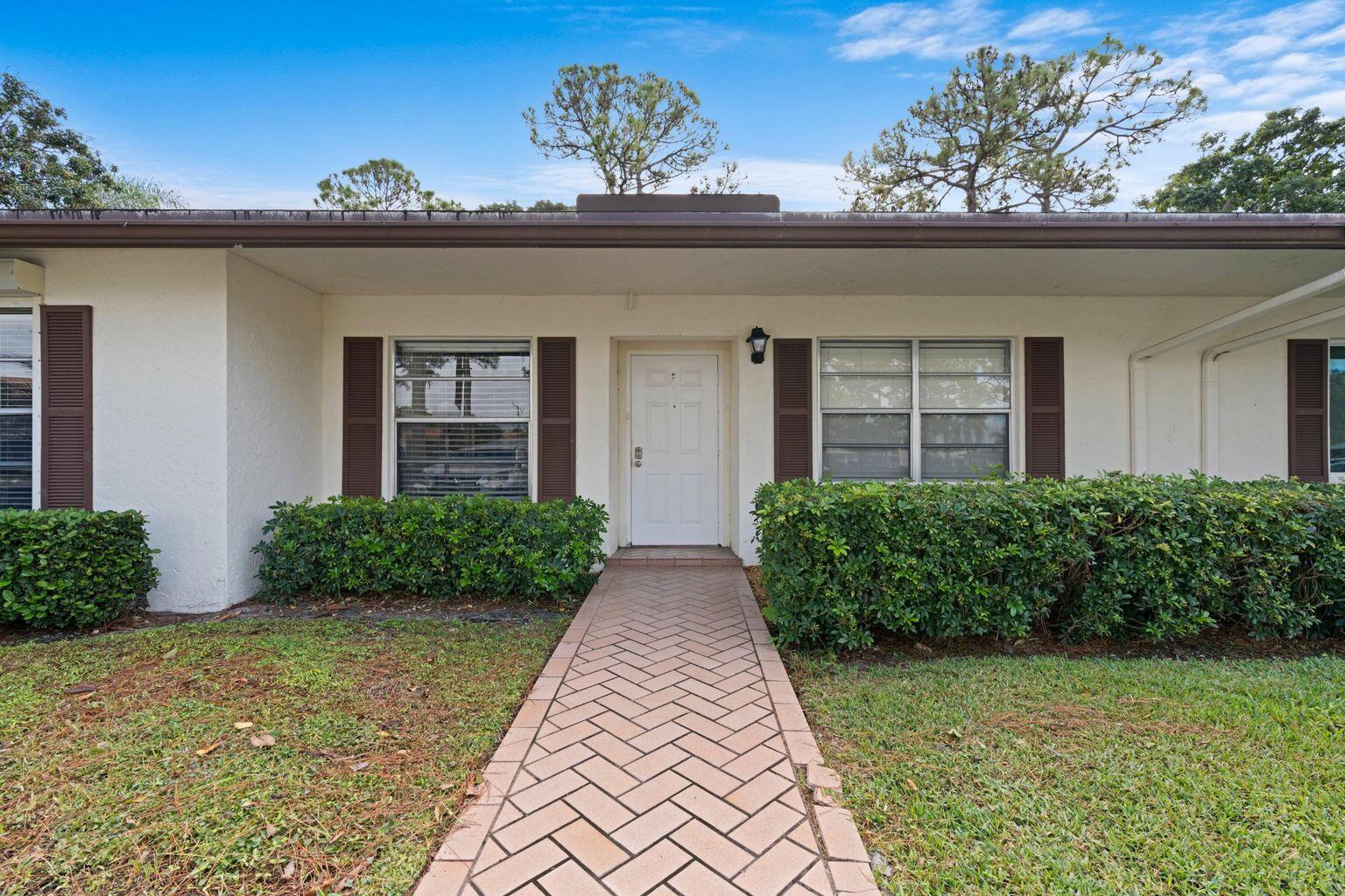 5400 Poppy Place, Unit B Delray Beach, FL 33484 - Photo 20 of 23 front view of a house