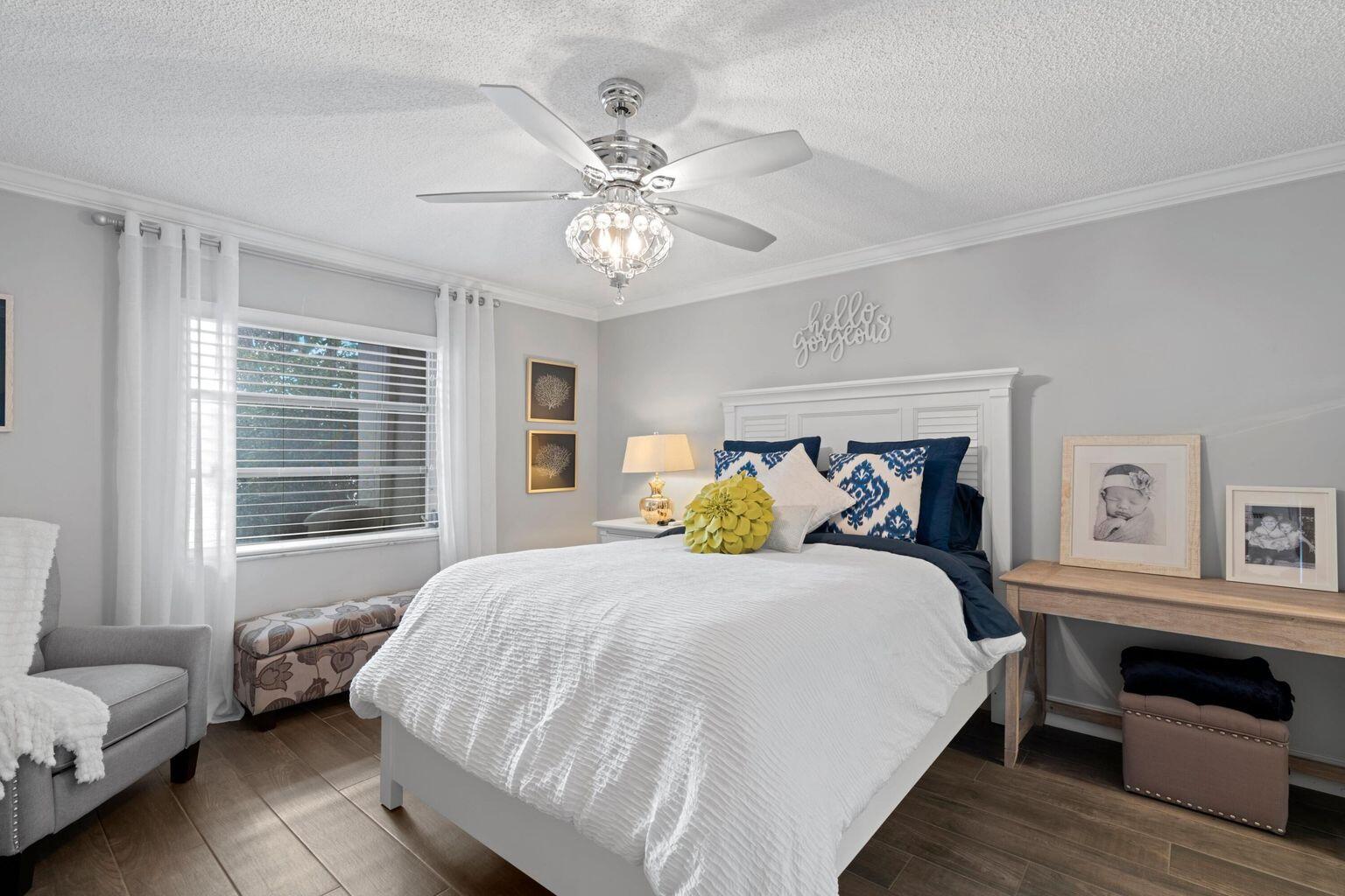 5400 Poppy Place, Unit B Delray Beach, FL 33484 - Photo 10 of 23 a bedroom with a bed and a window