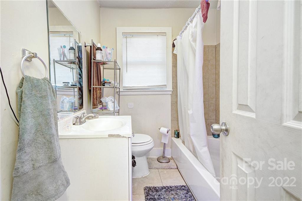 3128-3130 Ridge Avenue Charlotte, NC 28208 - Photo 14 of 22 a bathroom with a sink toilet and shower