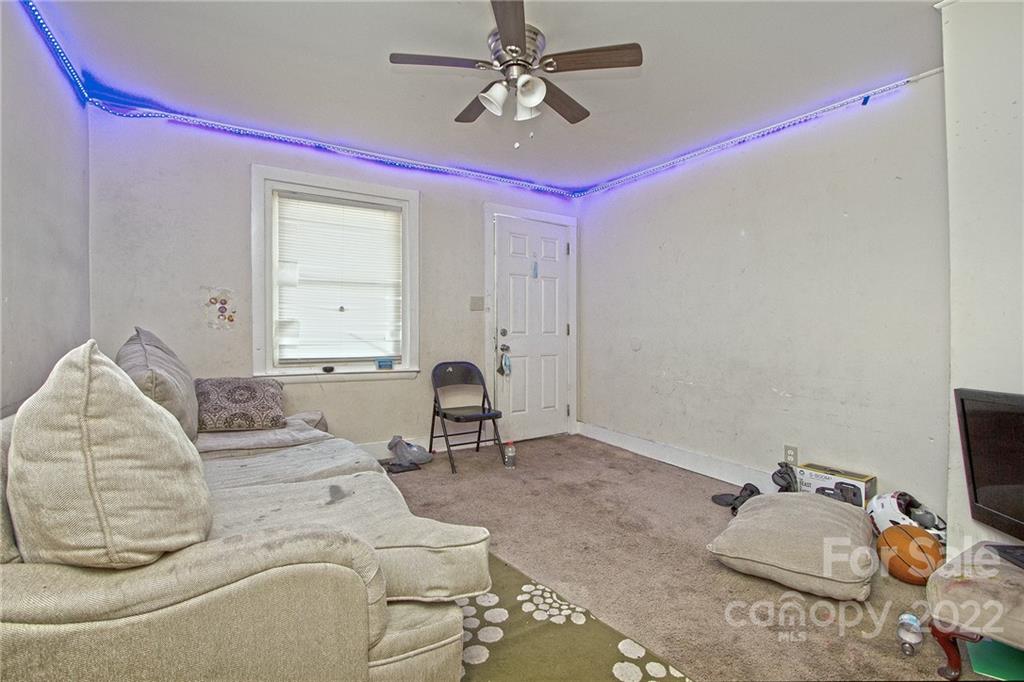 3128-3130 Ridge Avenue Charlotte, NC 28208 - Photo 15 of 22 a living room with furniture and a flat screen tv