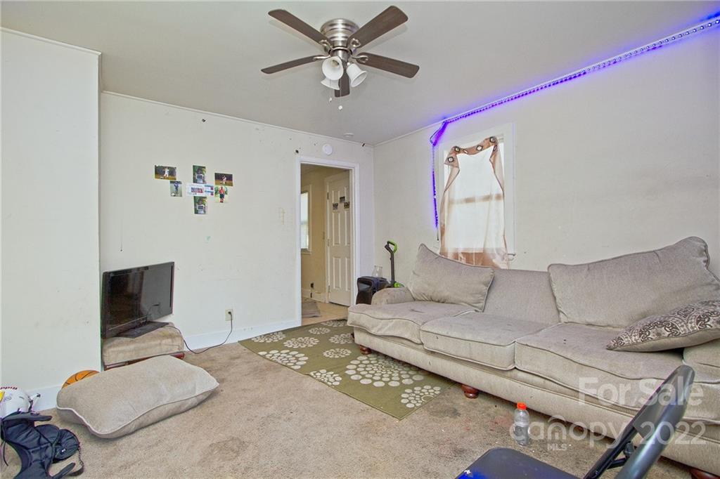 3128-3130 Ridge Avenue Charlotte, NC 28208 - Photo 16 of 22 a living room with furniture and a flat screen tv