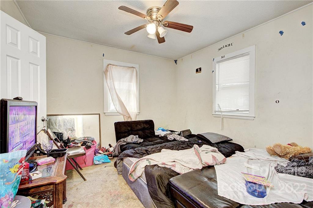 3128-3130 Ridge Avenue Charlotte, NC 28208 - Photo 21 of 22 a bedroom with furniture and a window