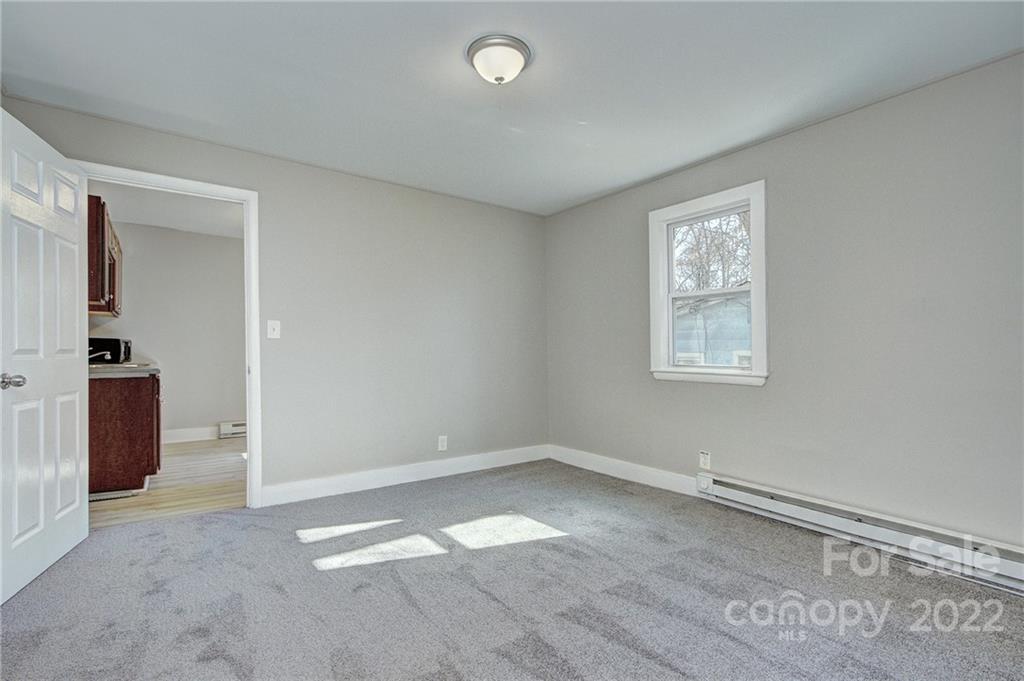 3128-3130 Ridge Avenue Charlotte, NC 28208 - Photo 8 of 22 an empty room with a empty space and windows