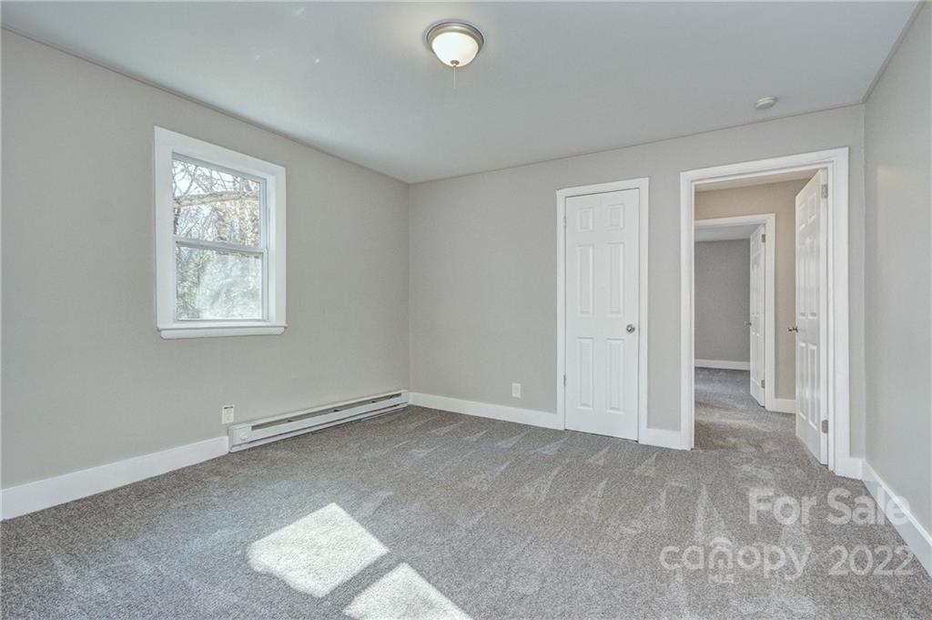 3128-3130 Ridge Avenue Charlotte, NC 28208 - Photo 10 of 22 an empty room with windows and closet