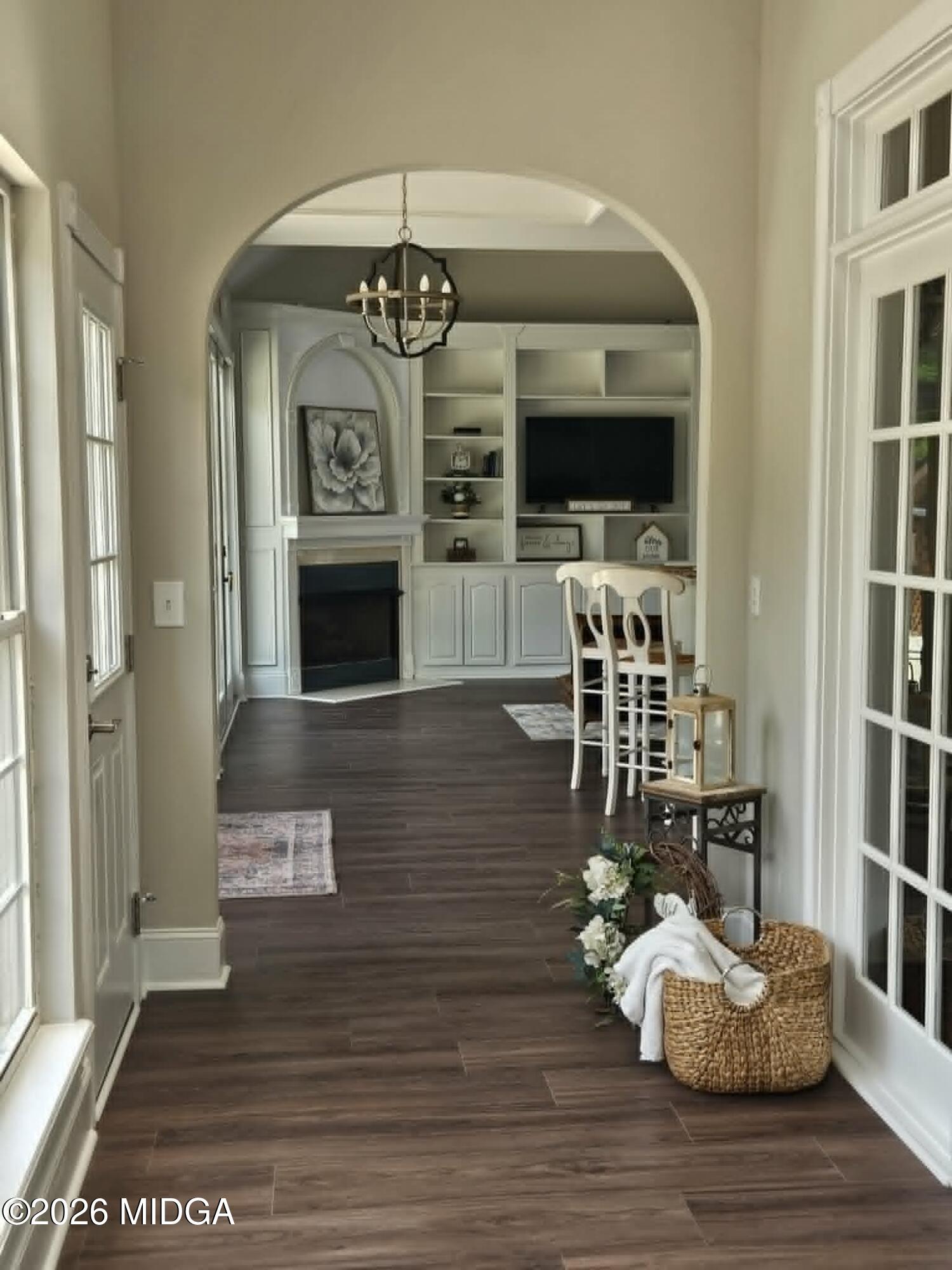 214 Tivoli Park Road Centerville, GA 31028 - Photo 2 of 26 a view of a dining room with furniture wooden floor and chandelier