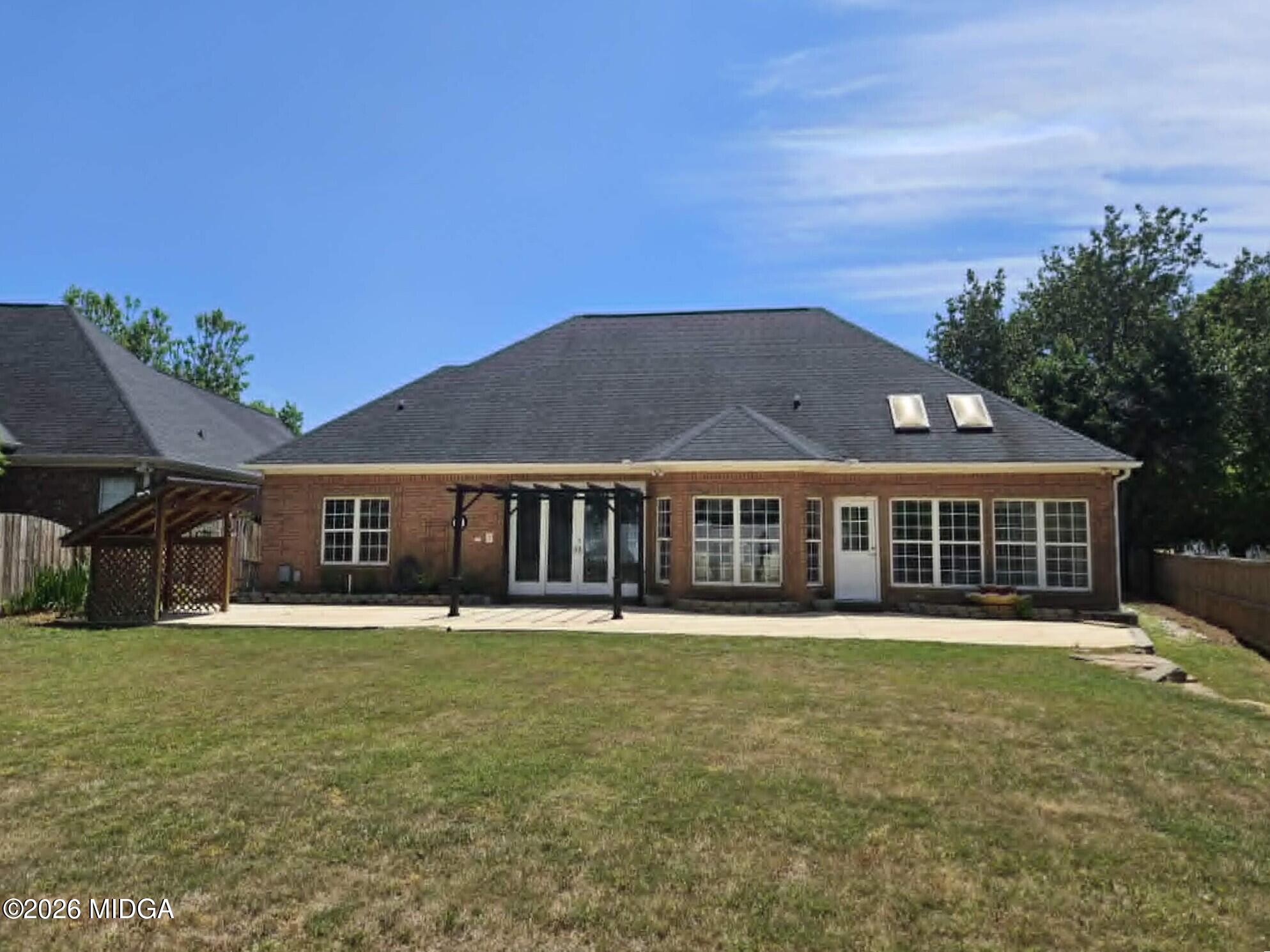 214 Tivoli Park Road Centerville, GA 31028 - Photo 23 of 26 front view of a house with a yard