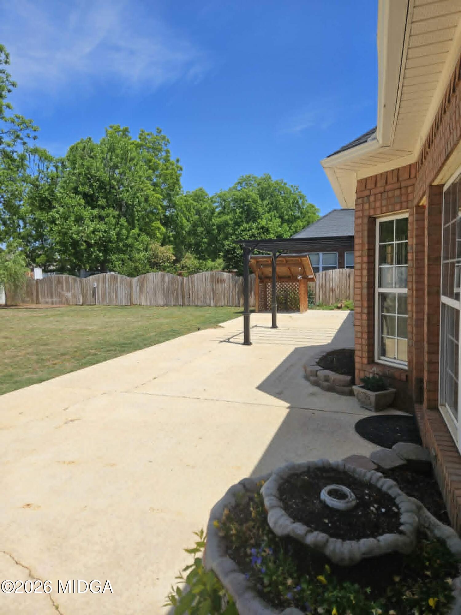 214 Tivoli Park Road Centerville, GA 31028 - Photo 25 of 26 a view of a swimming pool with an outdoor space and seating area