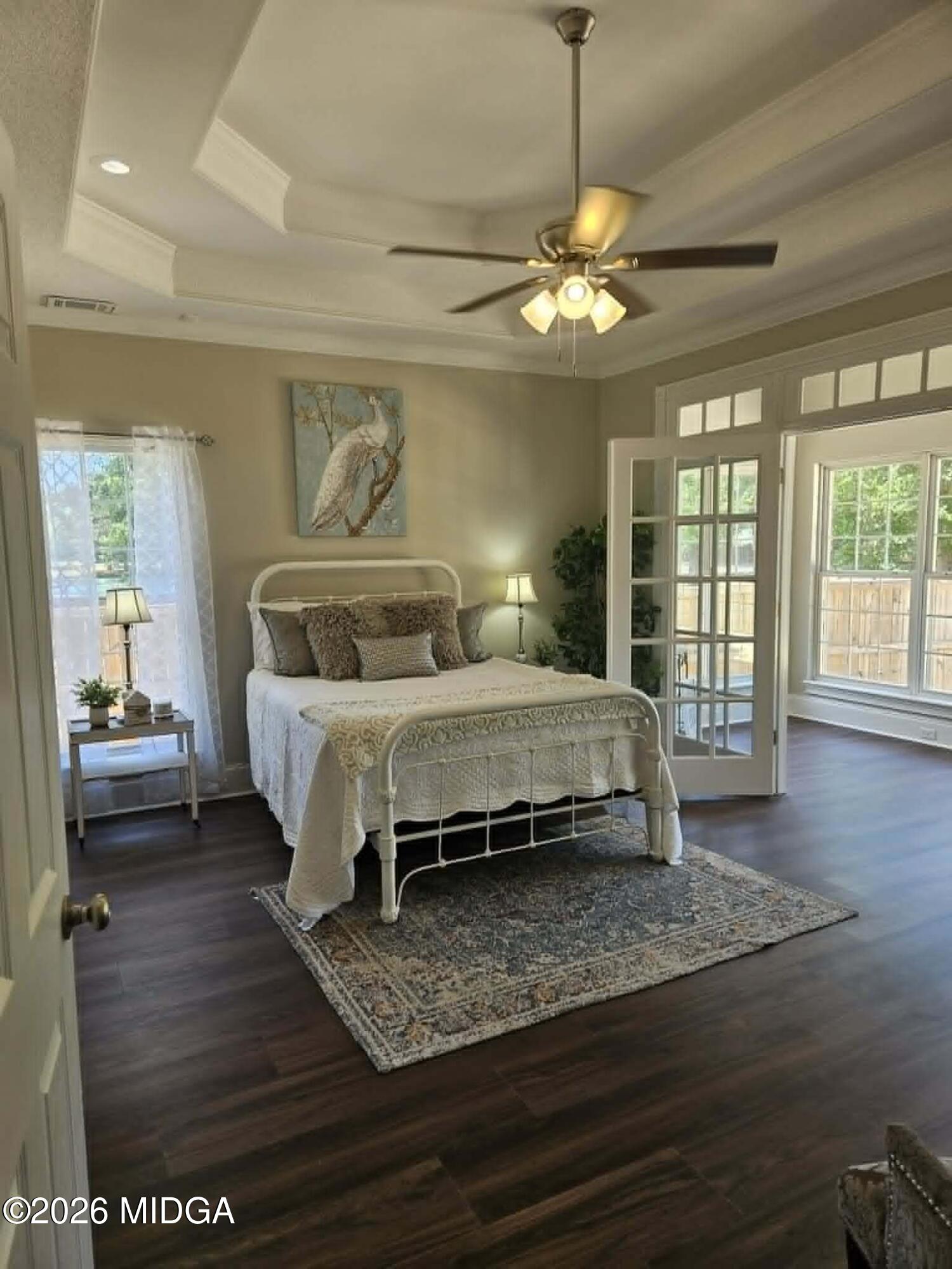 214 Tivoli Park Road Centerville, GA 31028 - Photo 10 of 26 a bedroom with a bed and wooden floor