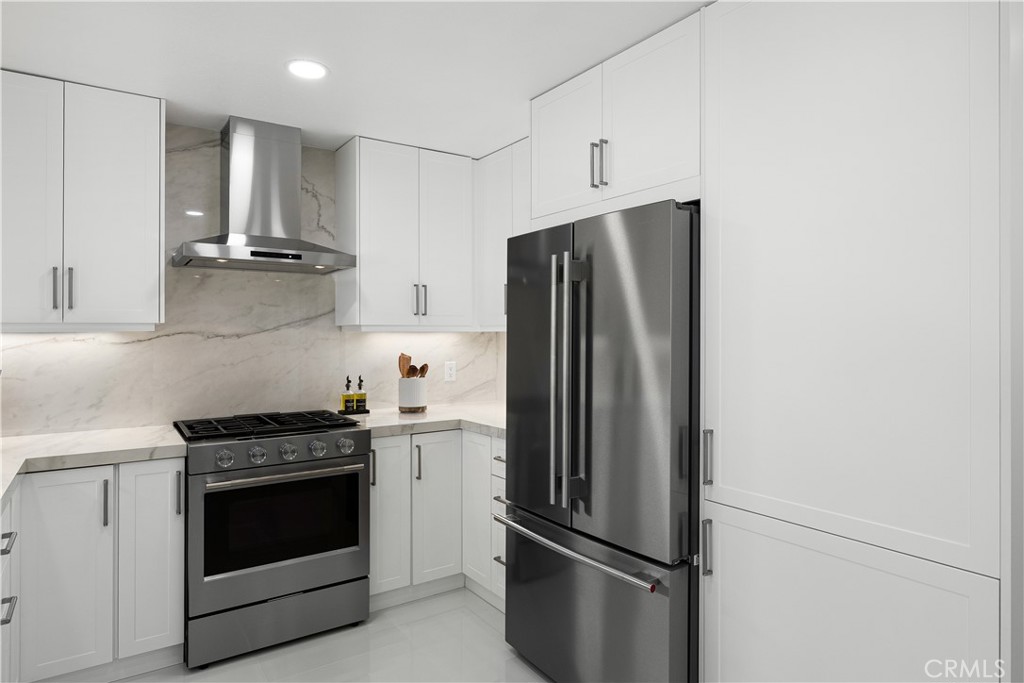 3004 Cardamon Street Rialto, CA 92376 - Photo 24 of 60 Gourmet Kitchen with KitchenAid Appliances & Full-Height Porcelain Slab Backsplash