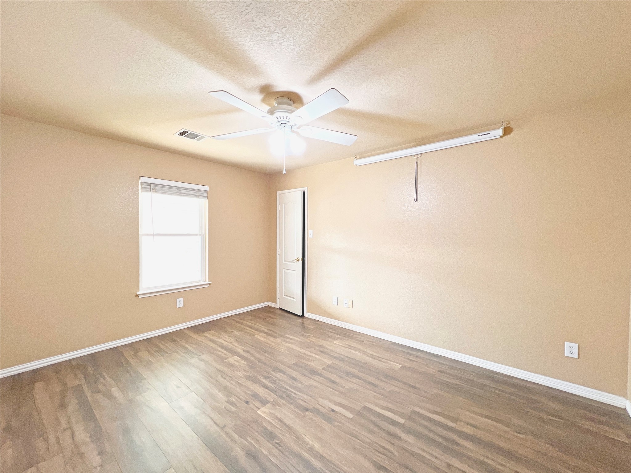 10018 San Ignacio Houston, TX 77075 - Photo 12 of 14 a view of an empty room with wooden floor and a window