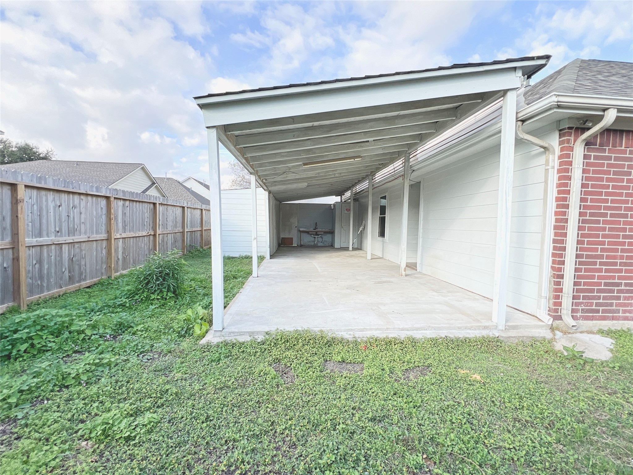 10018 San Ignacio Houston, TX 77075 - Photo 14 of 14 a view of a backyard with plants and large trees