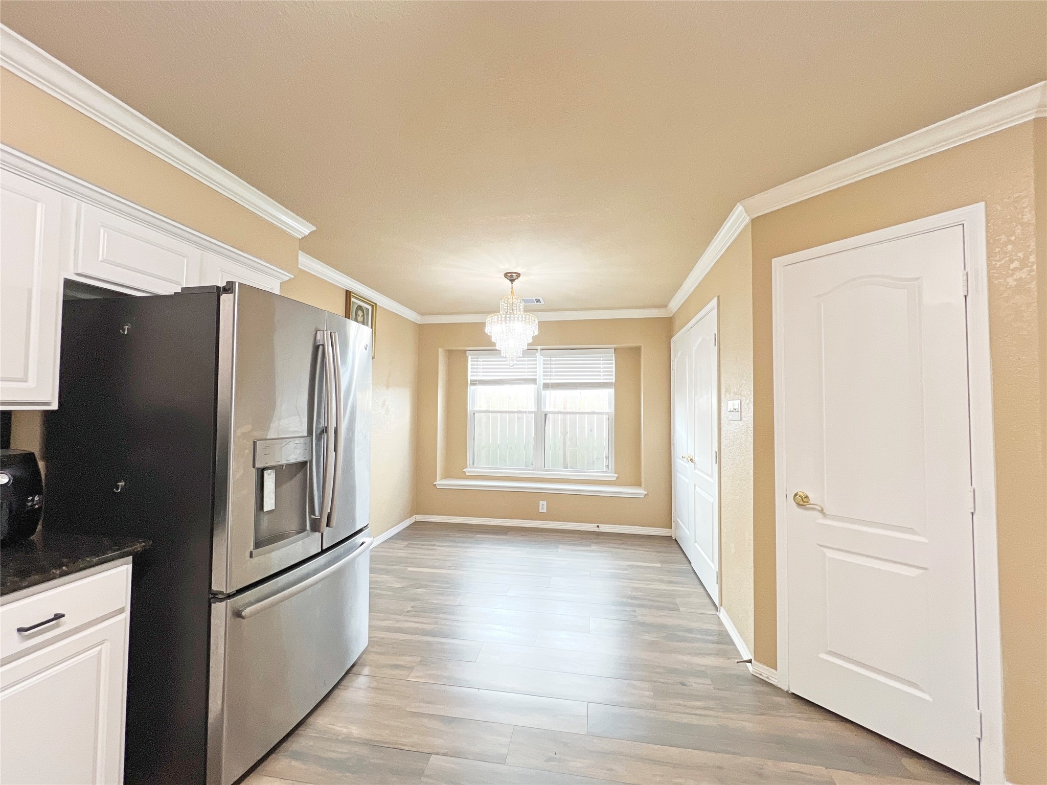 10018 San Ignacio Houston, TX 77075 - Photo 6 of 14 a kitchen with stainless steel appliances a refrigerator and a window