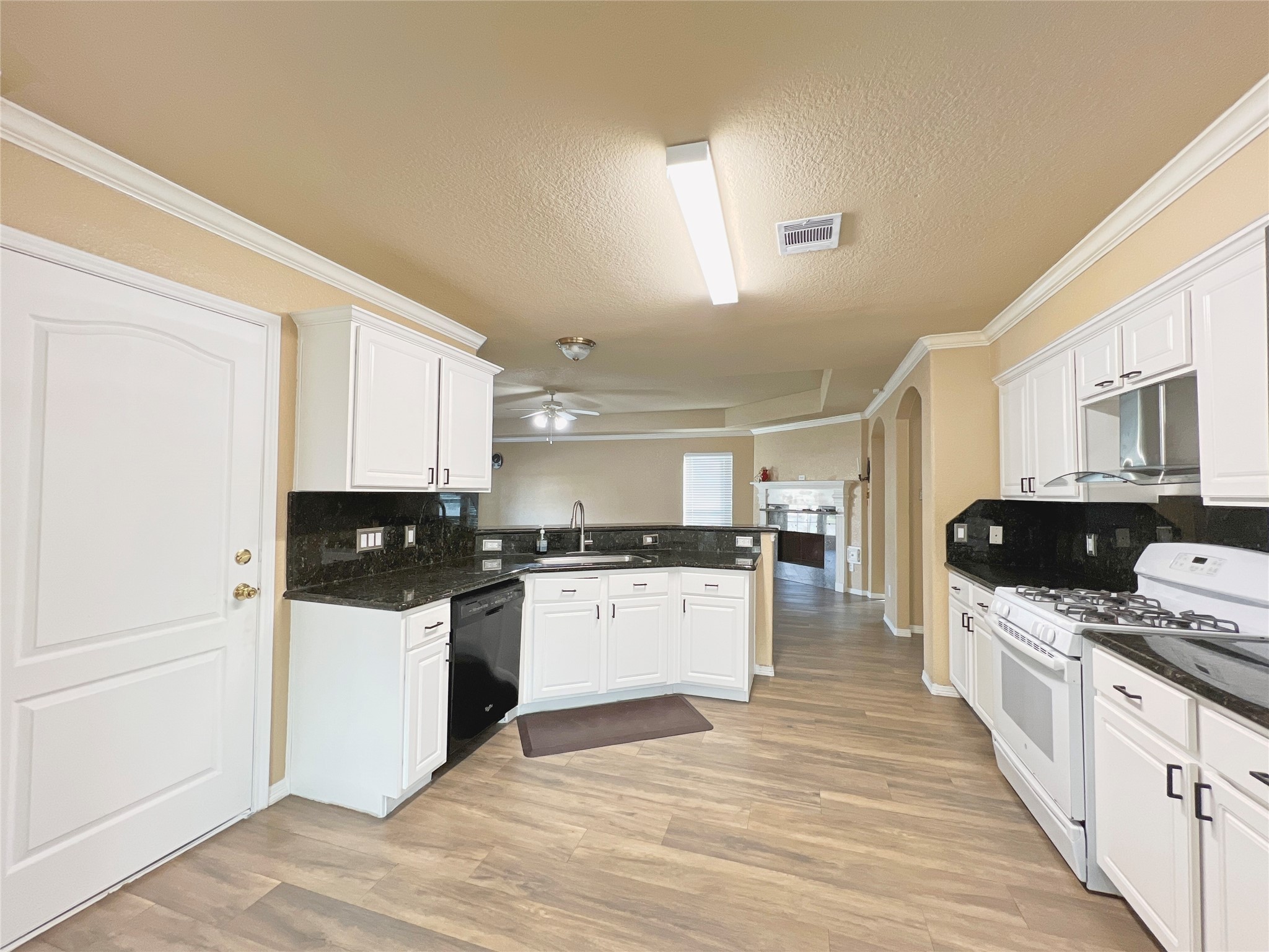 10018 San Ignacio Houston, TX 77075 - Photo 7 of 14 a kitchen with stainless steel appliances a sink and a refrigerator
