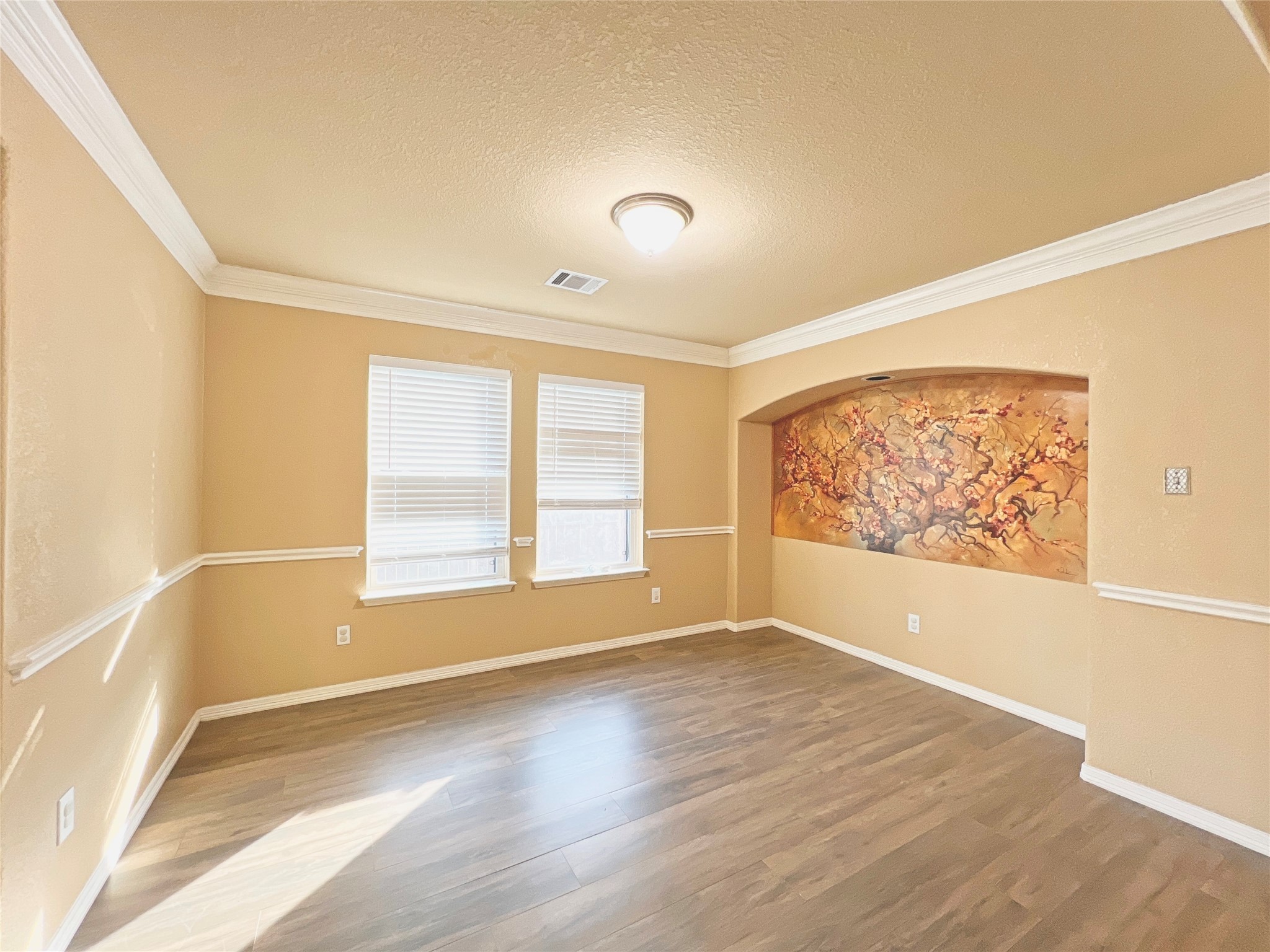 10018 San Ignacio Houston, TX 77075 - Photo 8 of 14 a view of an empty room with a window and wooden floor