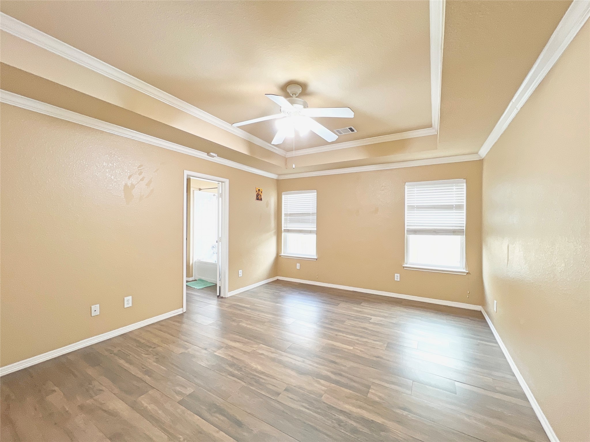 10018 San Ignacio Houston, TX 77075 - Photo 9 of 14 wooden floor in an empty room with a window