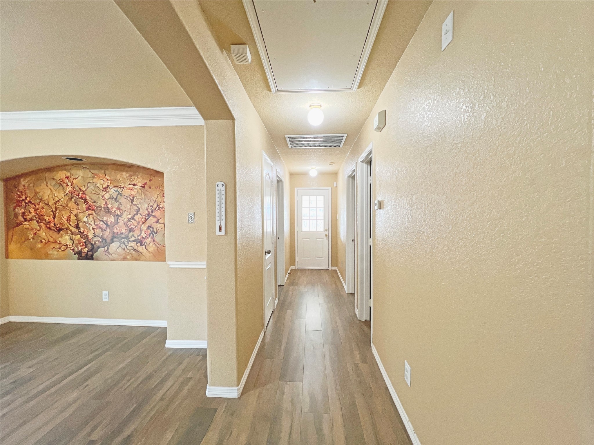 10018 San Ignacio Houston, TX 77075 - Photo 10 of 14 a view of a hallway with wooden floor