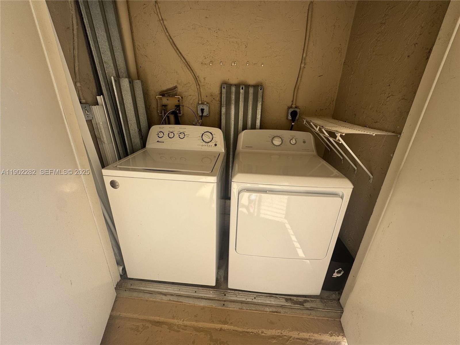 11730 Southwest 2nd Street, Unit 12202 Pembroke Pines, FL 33025 - Photo 16 of 18 a utility room with dryer and washer
