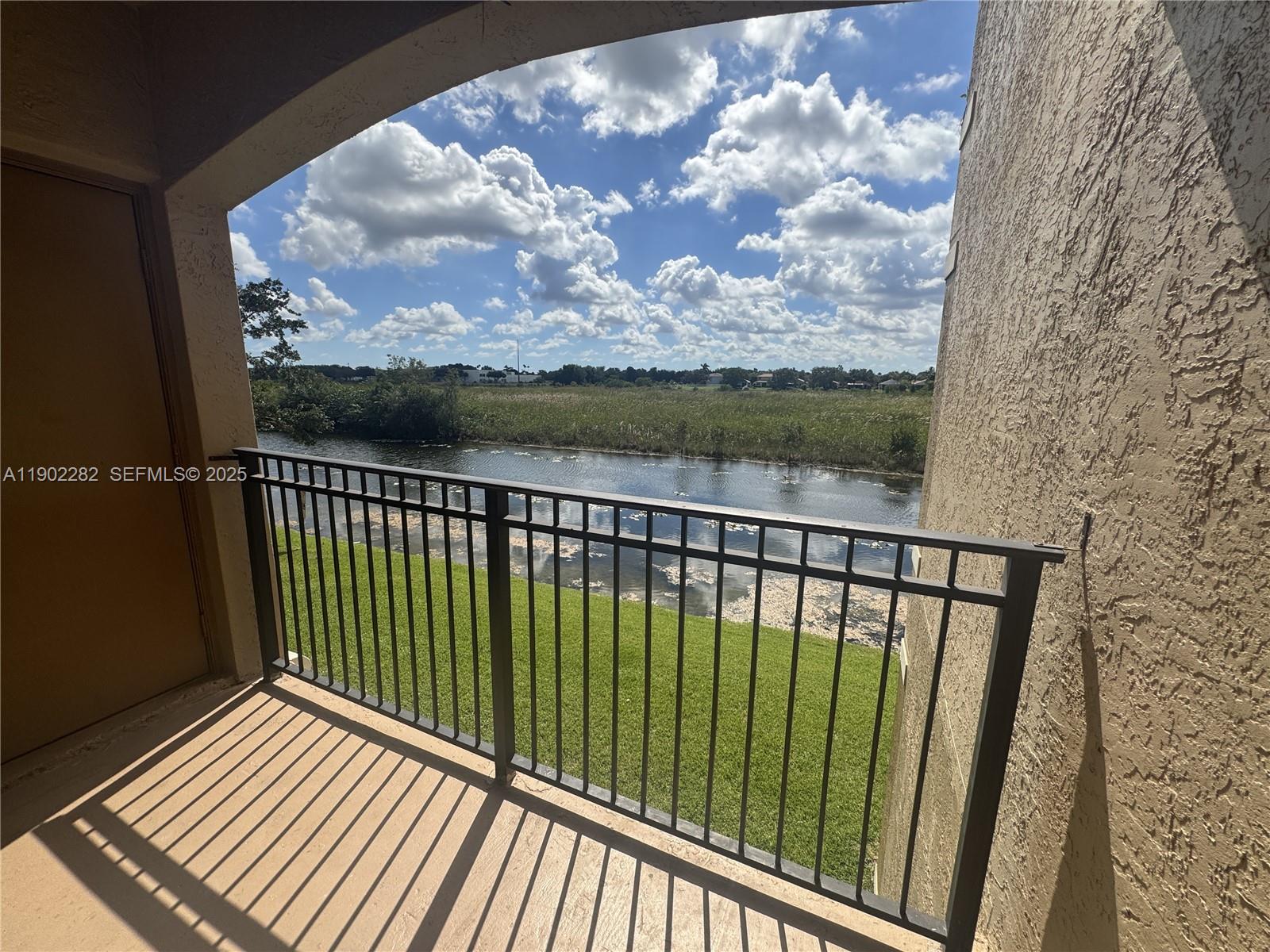 11730 Southwest 2nd Street, Unit 12202 Pembroke Pines, FL 33025 - Photo 17 of 18 a view of balcony with wooden floor