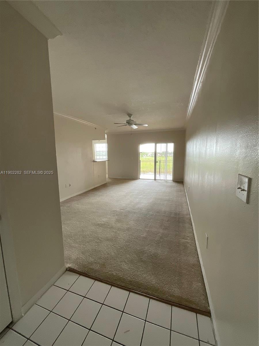 11730 Southwest 2nd Street, Unit 12202 Pembroke Pines, FL 33025 - Photo 4 of 18 a view of an empty room and window