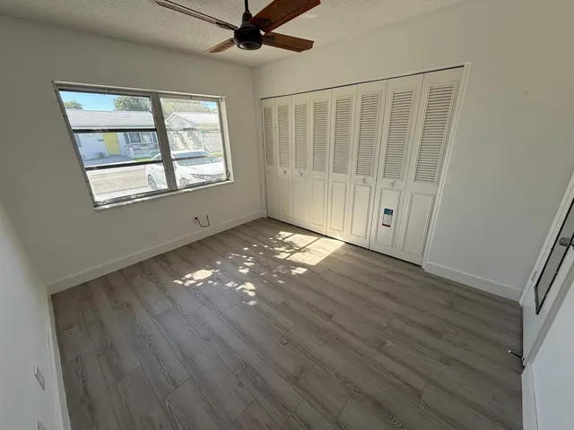 a view of entryway with wooden floor