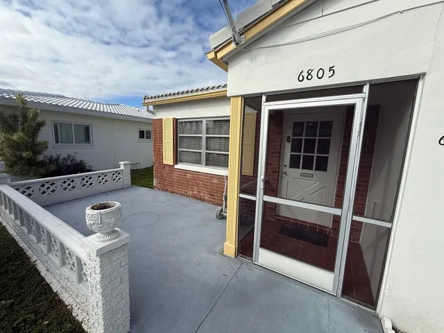 front view of a house with a small yard