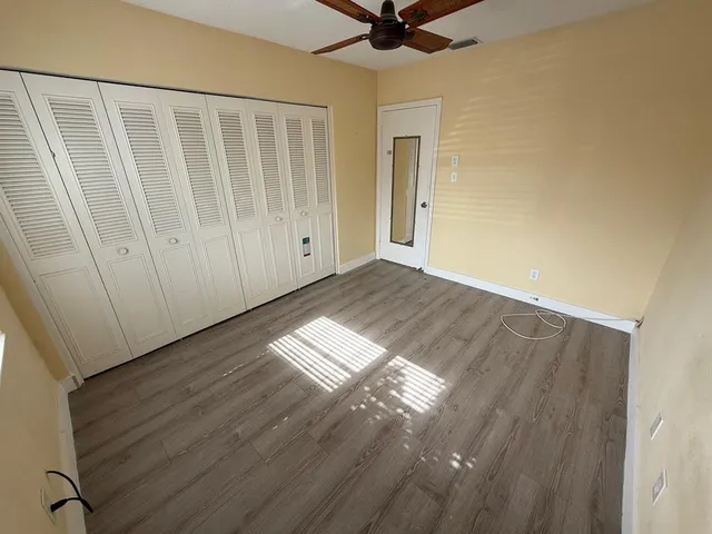 a view of a livingroom with wooden floor