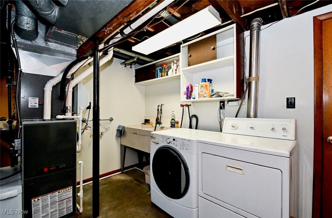 5653 Dailey Road New Franklin, OH 44319 - Photo 24 of 24 Clothes washing area featuring washer and dryer
